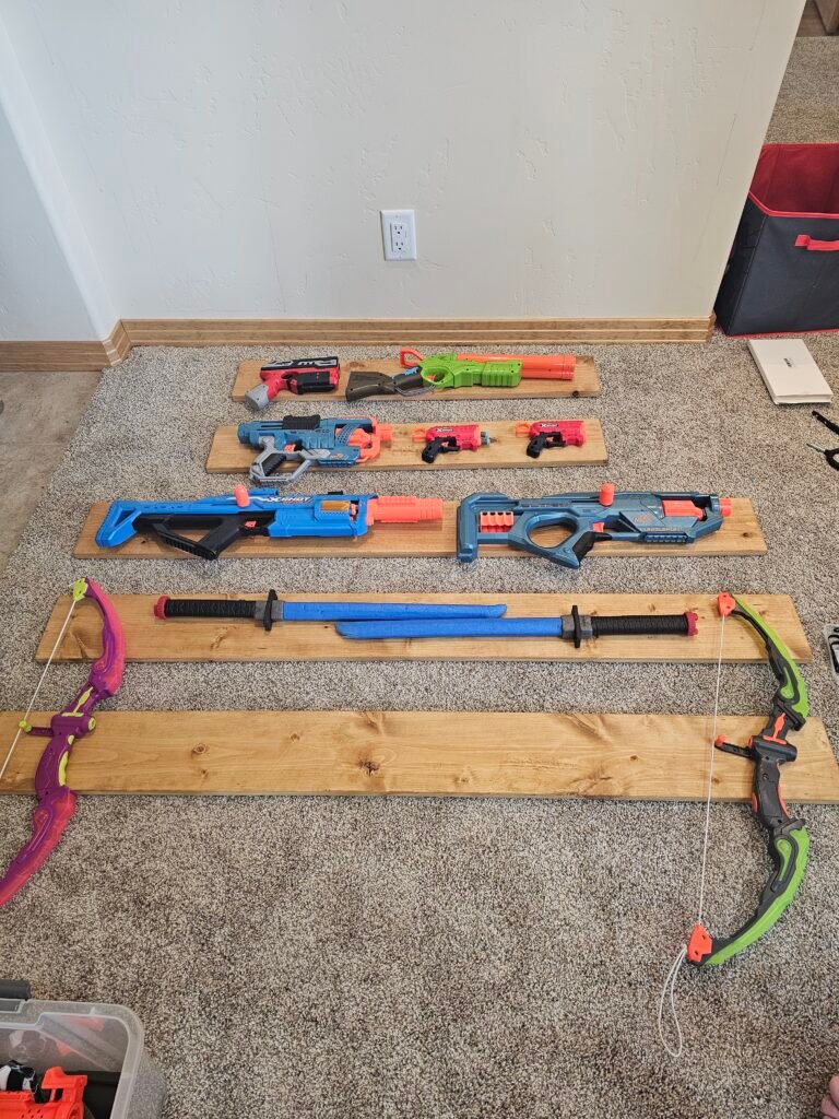 Laying out the Nerf guns on the boards